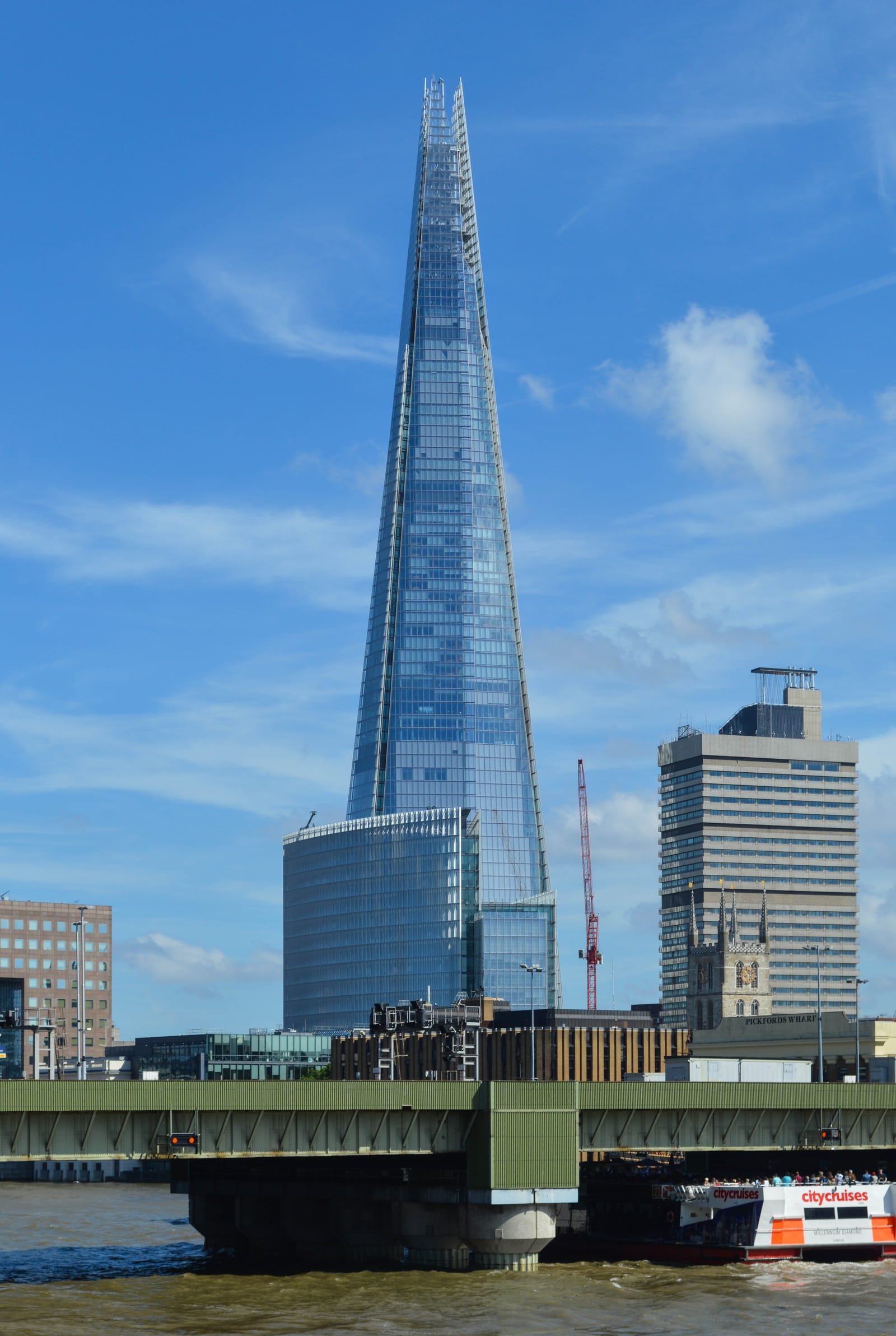 The Shard rising above London Bridge, photographed from Southwark Bridge.