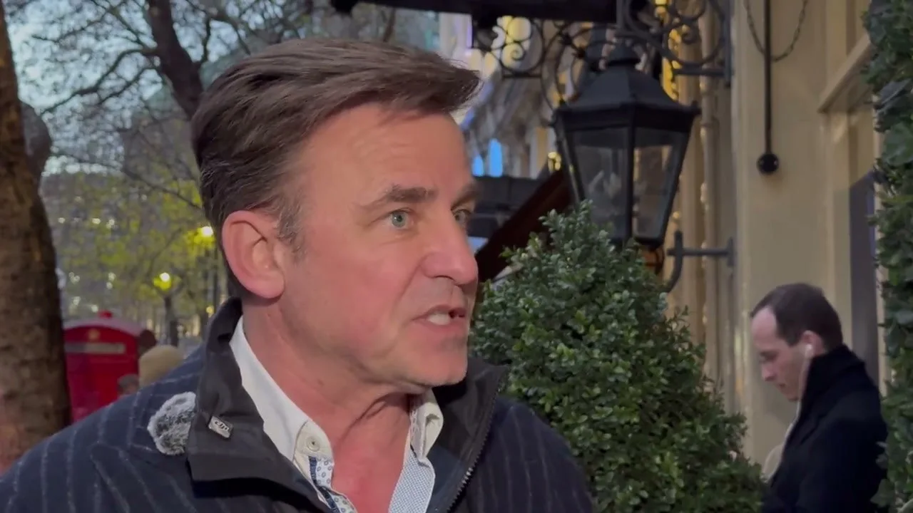 An interview on a London street, a red phone box behind